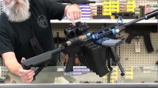 This AR-15 Monster Rifle From Hell Comes Loaded With 9 Magazines, 3 Lasers, 3 Red Dot Sights and More